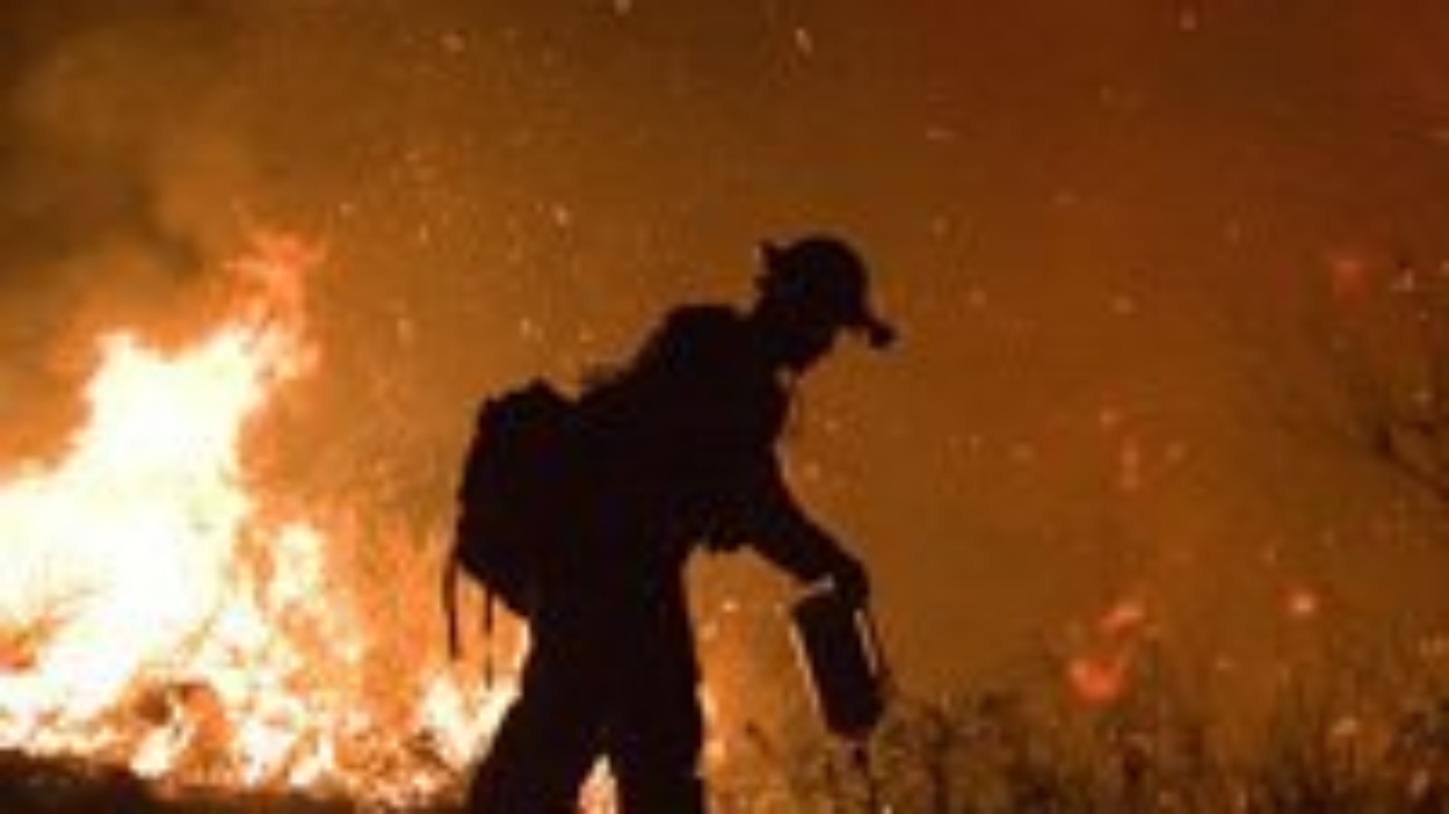 Firefighter fighting burning fire